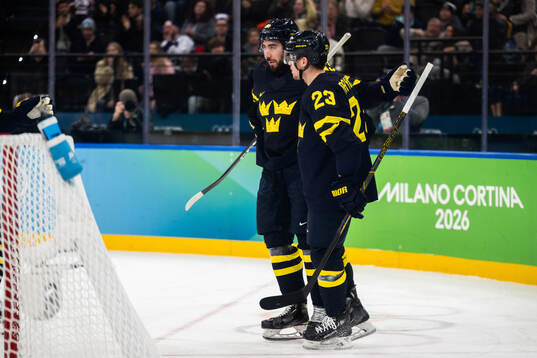 Mika Zibanejad and Lucas Raymond of Sweden celebrate