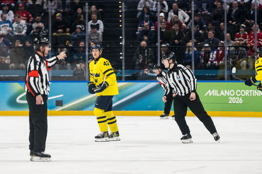 Gustav Forsling of Sweden receives a penalty in the men's