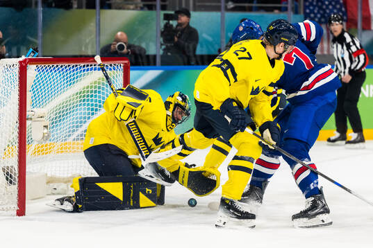 Goaltender Jacob Markström of Sweden and Brady Tkachuk of