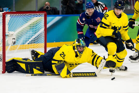 Goaltender Jacob Markström and Gustav Forsling of Sweden
