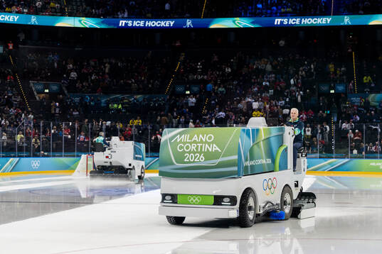 Zambonis resurfacing the ice