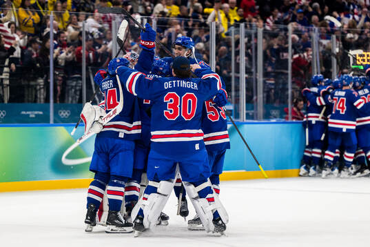 Tage Thompson of USA celebrates with teammates