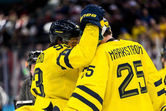 Mika Zibanejad and goaltender Jacob Markström of Sweden