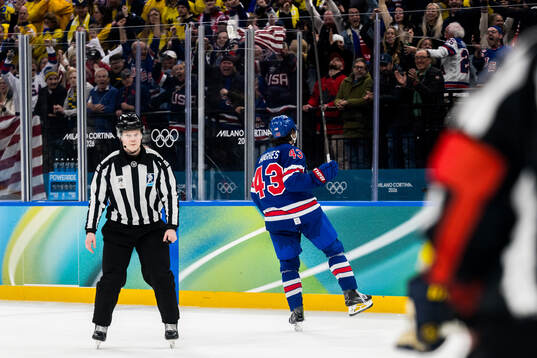Quinn Hughes of USA celebrates