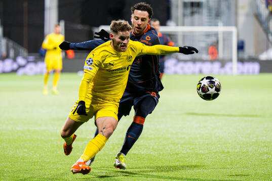 Ole Didrik Blomberg of Bodø/Glimt and Carlos Augusto of