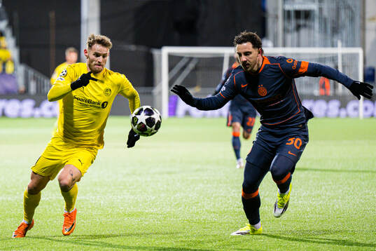 Ole Didrik Blomberg of Bodø/Glimt and Carlos Augusto of