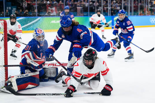 goaltender Aerin Frankel and Caroline Harvey of USA against