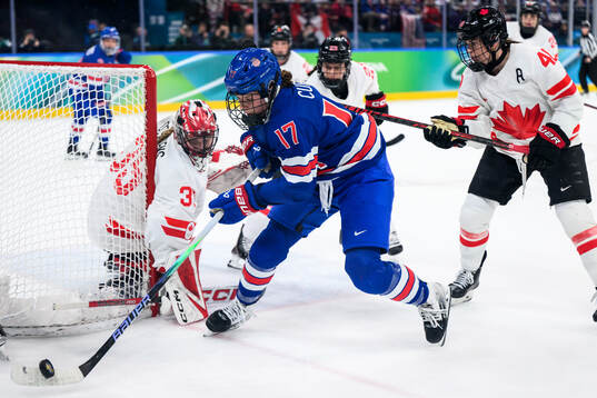 goaltender Ann-Renee Desbiens of Canada and Britta Curl of