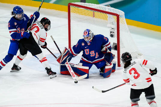 Megan Keller and goaltender Aerin Frankel of USA against