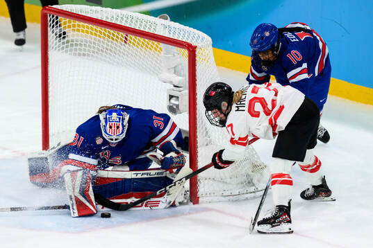 goaltender Aerin Frankel and Laila Edwards of USA against