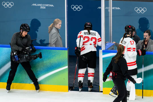 Erin Ambrose of Canada leaves the ice with an injury in the