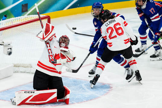 goaltender Ann-Renee Desbiens and Emily Clark of Canada