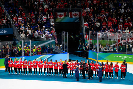 team Switzerland receive their bronze medals at the medal