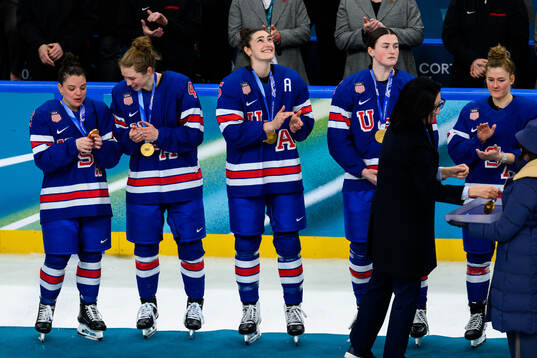 Megan Keller of USA with her gold medal at the medal