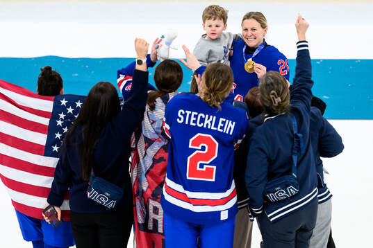 Kendall Coyne of USA celebrates with her gold medal