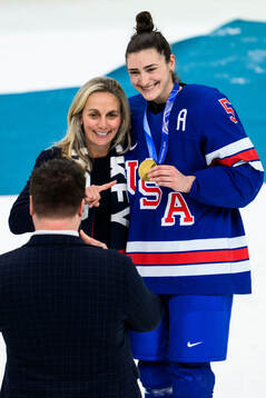 Ellen Hughes and Megan Keller of USA celebrate