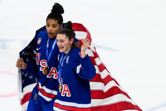 Laila Edwards and Megan Keller of USA celebrate