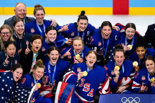 Megan Keller and Hilary Knight of USA celebrate with