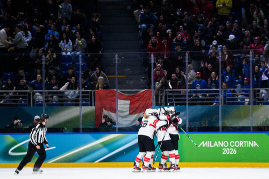Sinja Leemann of Sweden celebrates with teammates