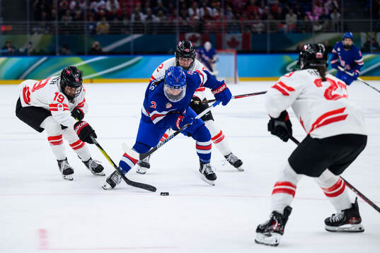 Cayla Barnes of USA against Brianne Jenner, Claire Thompson