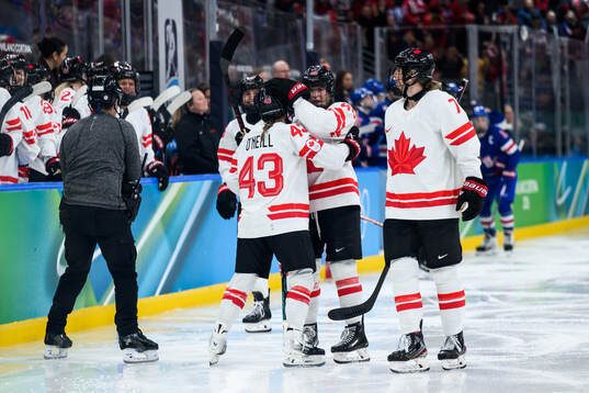 Kristin O'Neill and Blayre Turnbull of Canada celebrates