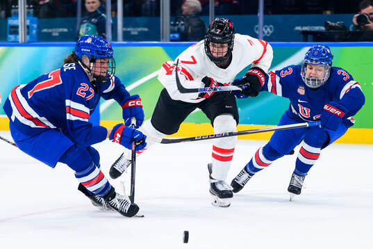 Laura Stacey of Canada against Taylor Heise and Cayla