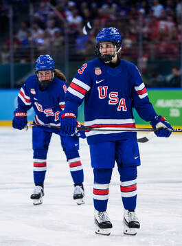 Caroline Harvey and Cayla Barnes of USA look dejected in