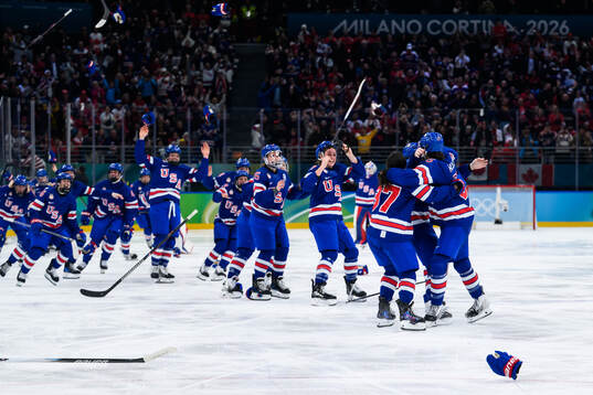Megan Keller of USA celebrates with teammates