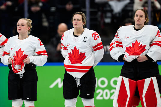 Emma Maltais , Marie-Philip Poulin and goaltender Ann-Renee