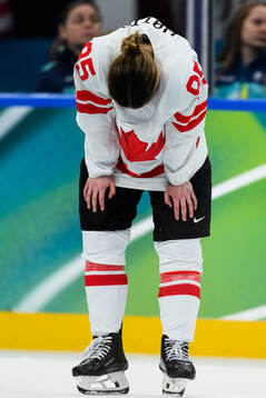 Daryl Watts of Canada looks dejected