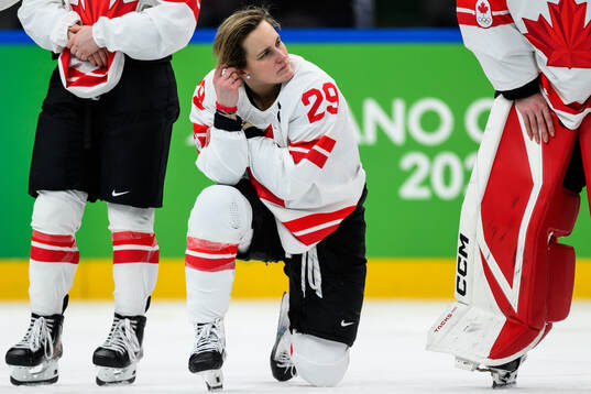 Marie-Philip Poulin of Canada looks dejected