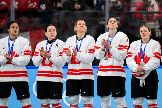 Players of Canada look dejected at the medal ceremony