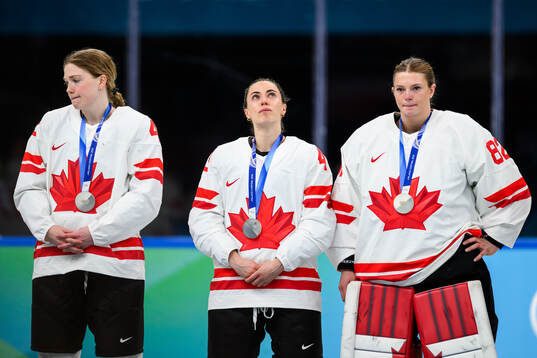 Claire Thompson, Kristin O'Neill and goaltender Kayle