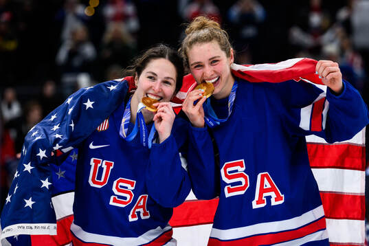 Abbey Murphy and Caroline Harvey of USA celebrate with