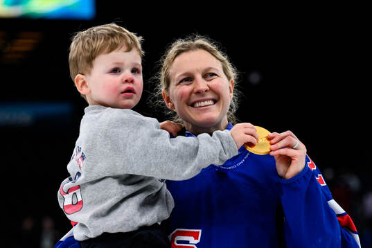 Kendall Coyne of USA celebrates with her gold medal