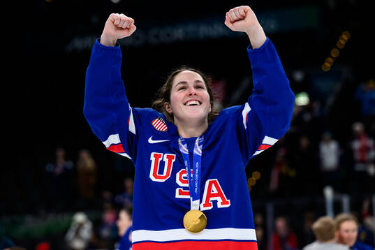 Abbey Murphy of USA celebrates with her gold medal