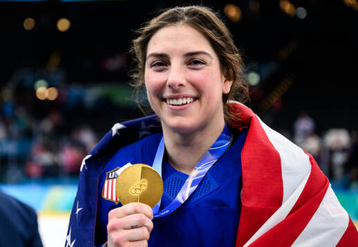 Hilary Knight of USA celebrates with her gold medal