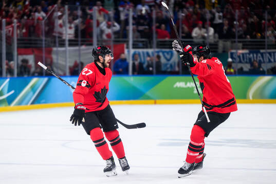 Shea Theodore of Canada celebrates the 2-2 goal in the