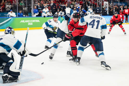 Brad Marchand of Canada against Miro Heiskanen of Finland