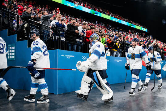Goaltender Juuse Saros of Finland looks dejected