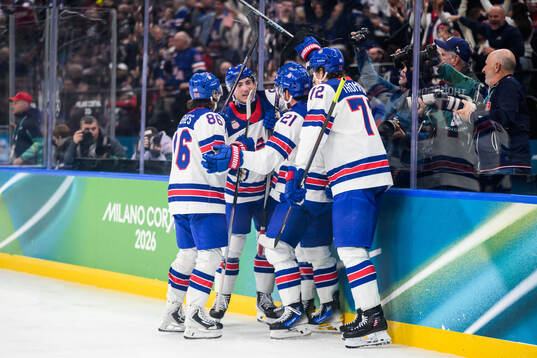 Dylan Larkin of USA celebrate with teammates
