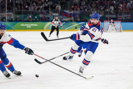 Dylan Larkin of USA scores the 1-0 goal in the men's ice
