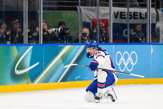 Jack Hughes of USA celebrates the 3-0 goal in the men's ice