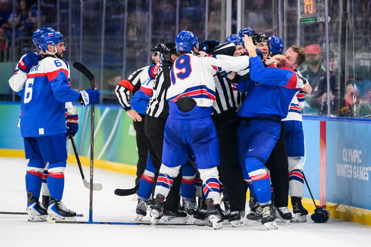 Matthew Tkachuk of USA and Erik Cernak of Slovakia in the
