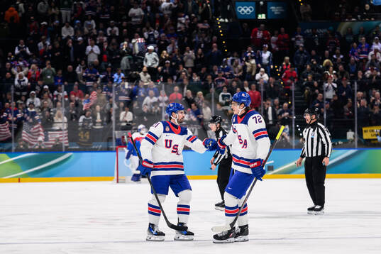 Dylan Larkin and Tage Thompson of USA celebrate the 1-0