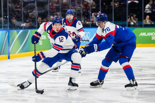 Matt Boldy of USA and Martin Pospisil of Slovakia in the