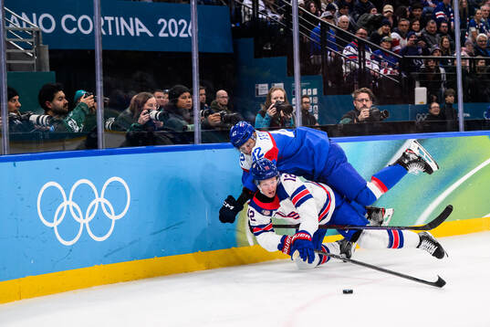 Matt Boldy of USA and Martin Fehervary of Slovakia in the