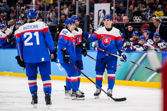 Juraj Slafkovsky celebrate with Martin Fehervary of Slovakia