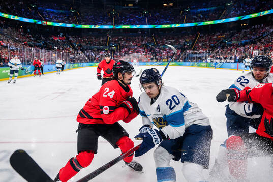 Seth Jarvis of Canada and Sebastian Aho of Finland in the