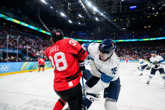 Brandon Hagel of Canada and Anton Lundell of Finland in the
